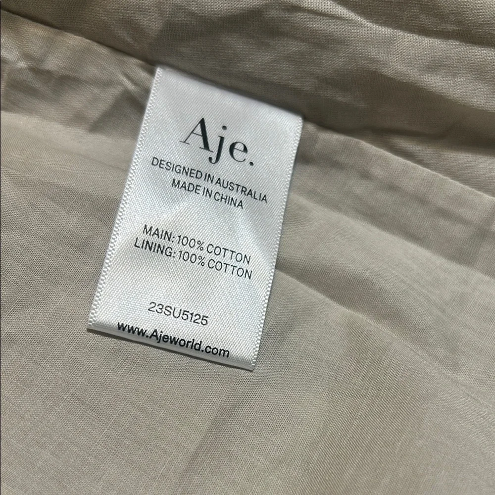 NWOT. Aje Novella Mini Smock Dress. Stylish Beige Dress with Ruffle Hem - Picture 8 of 13